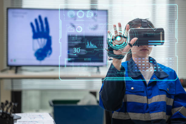 gettyimages-2172163821-612×612 Multiracial engineer perfects robotic hand control using digitization ,coding, AI, and automation for future tech in laboratory room.